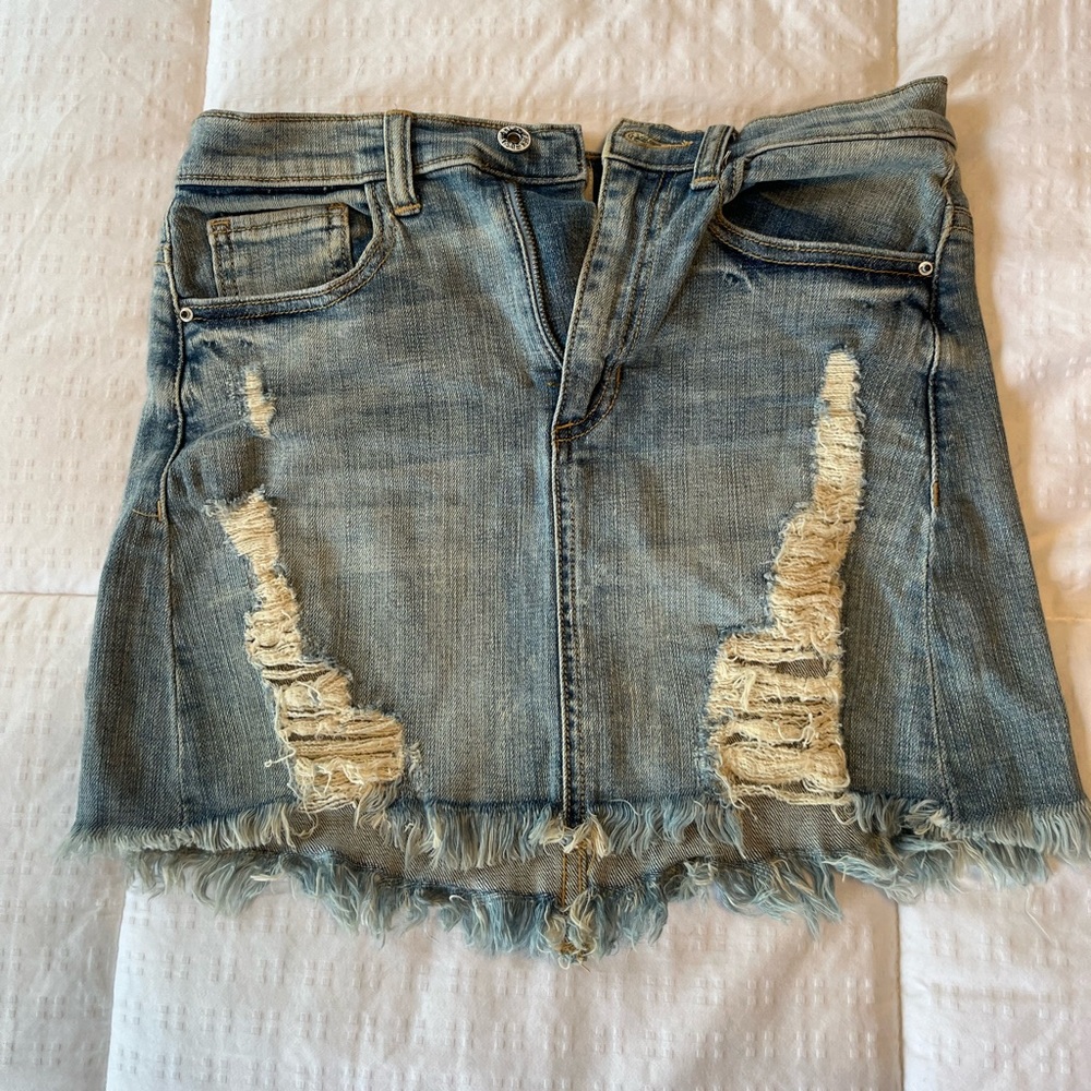 Distressed denim mini skirt